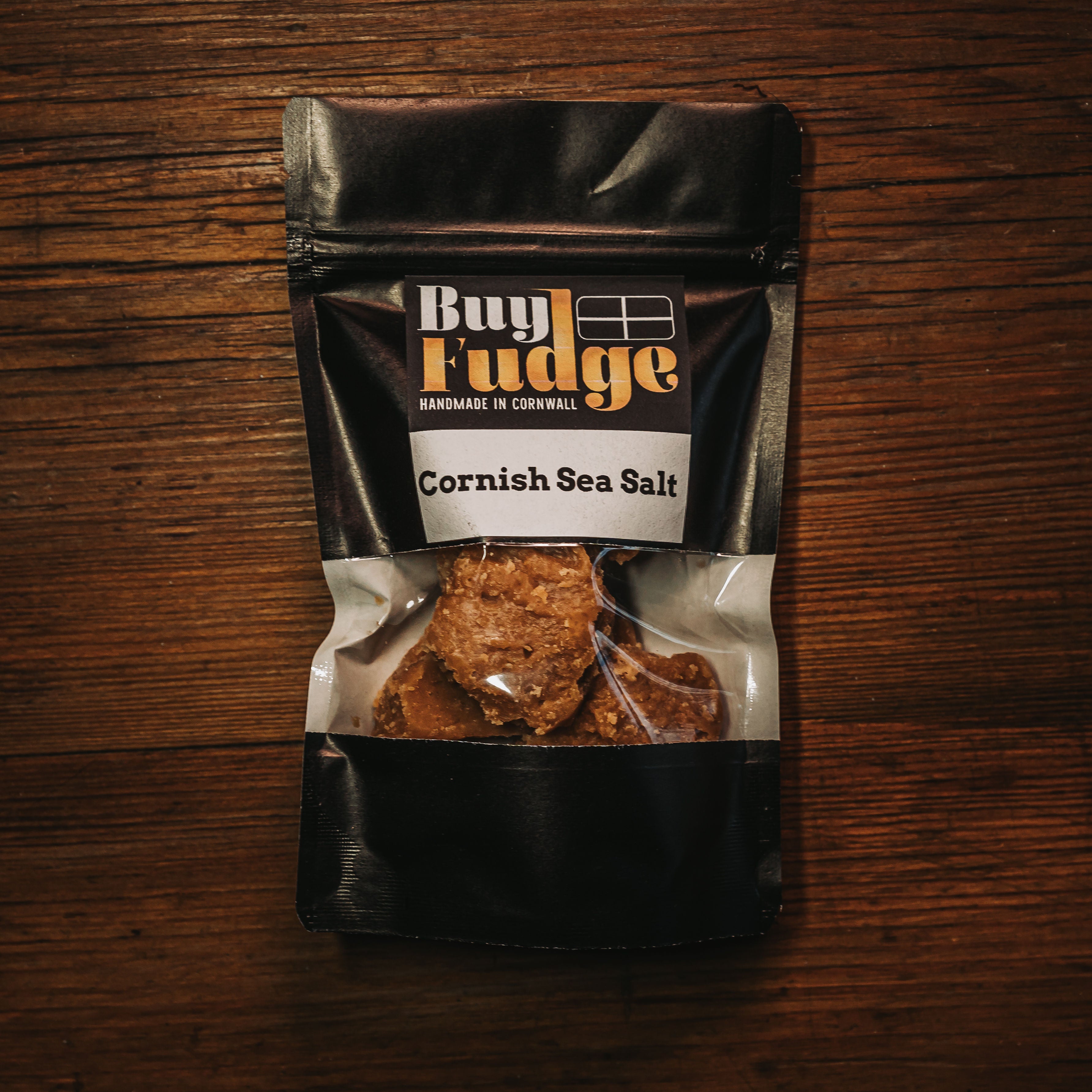 Cornish Sea Salt And Clotted Cream Fudge Handmade in Cornwall On A Wooden Background